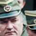 Bosnian Serb General Ratko Mladic leaves a meeting at the airport in Sarajevo, Bosnia and Herzegovina April 13, 1993. He is wearing a green and gold military peaked cap.