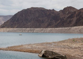 A World War II-era Higgins landing craft rests on the exposed shoreline at Lake Mead National Recreation Area
