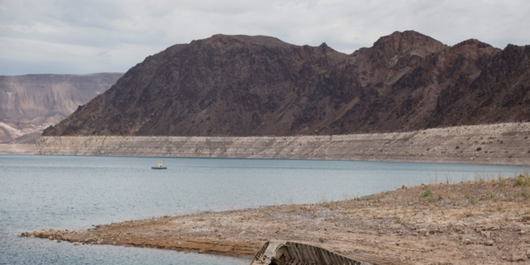 A World War II-era Higgins landing craft rests on the exposed shoreline at Lake Mead National Recreation Area