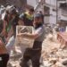 Residents dig through the debris of a collapsed building after an earthquake, in Cali, Colombia