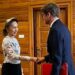 Former Myanmar president Aung San Suu Kyi shakes hands with an official from the International Committee of the Red Cross
