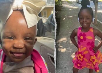 The two young girls smiling.