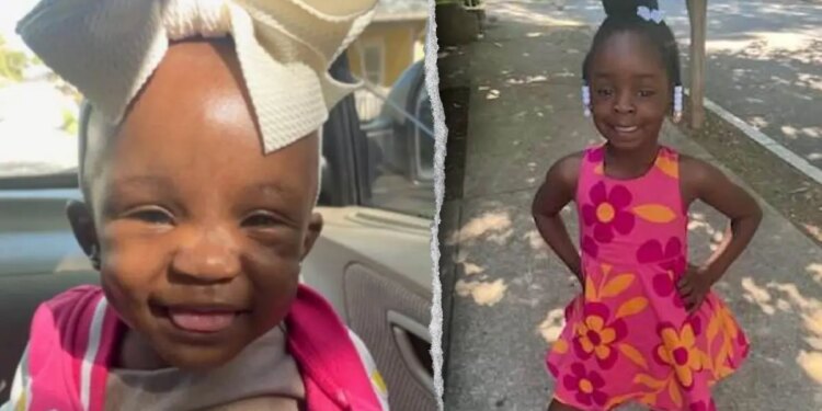 The two young girls smiling.