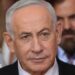 Close up of Benjamin Netanyahu from the shoulders up. He has short, grey hair and is wearing a shirt, tie and suit.