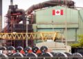 A Canadian flag visible on the ArcelorMittal Dofasco steel plant in Hamilton.