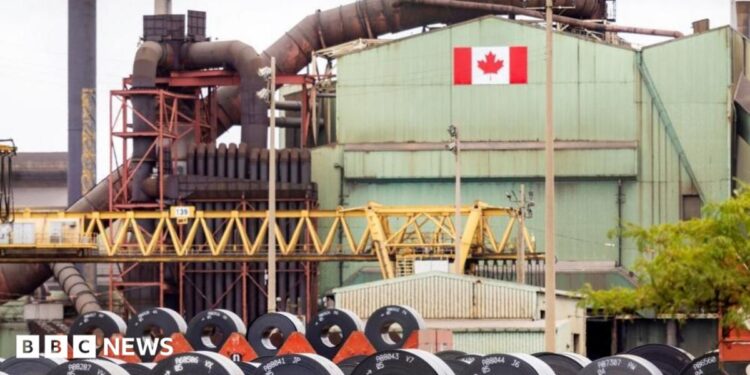 A Canadian flag visible on the ArcelorMittal Dofasco steel plant in Hamilton.
