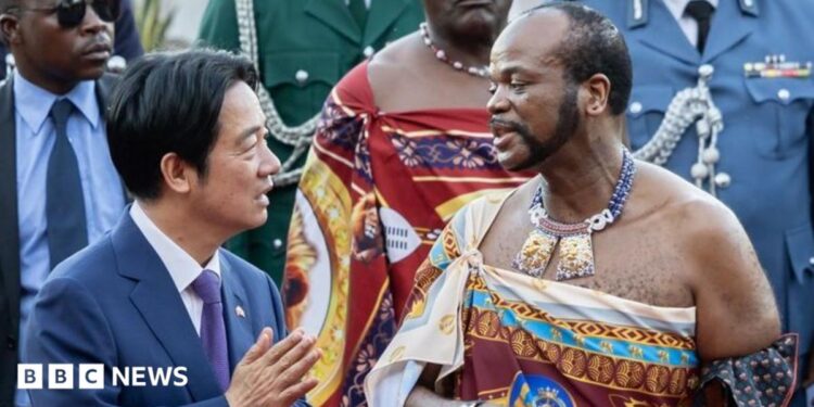 Taiwan's President Lai Ching-te (in navy blue suit white shirt and blue tie) and Eswatini's King Mswati III (in traditional royal regalia) talking