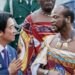 Taiwan's President Lai Ching-te (in navy blue suit white shirt and blue tie) and Eswatini's King Mswati III (in traditional royal regalia) talking