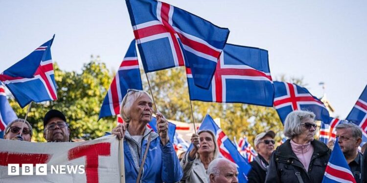 Supporters of the 'No' campaign wave Icelandic flags during a rally against reopening Iceland's European Union accession negotiations in Reykjavik, Iceland, on August 27, 2026