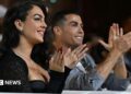Ronaldo and his partner clap and smile in Dubai in 2014