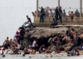 migrants swimming into Ceuta
