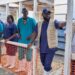A row of men and women in medical uniforms and white wellington boots at the inauguration of a new Ebola treatment centre in Rwakole, Bunia, DR Congo.