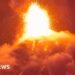 Orange lava erupts into the night sky