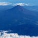 Mount Fuji is pictured from the skies with a ring of white cloud bordering the frame of the image