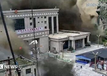 CCTV shows people running as mud and water destroys buildings in Gyirong, Tibet