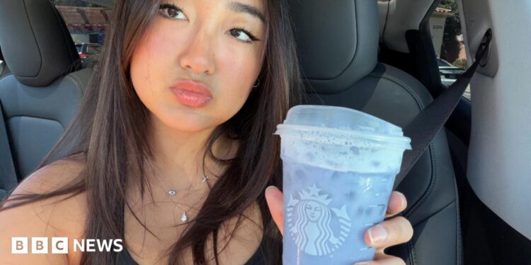 Elaine Ling holds a lavender Grande Ocean Drink from Starbucks