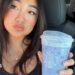 Elaine Ling holds a lavender Grande Ocean Drink from Starbucks