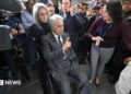 Lenin Moreno leaves the National Court of Justice during a corruption case in Quito.
