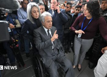 Lenin Moreno leaves the National Court of Justice during a corruption case in Quito.