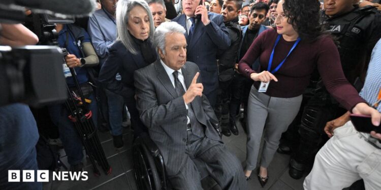Lenin Moreno leaves the National Court of Justice during a corruption case in Quito.