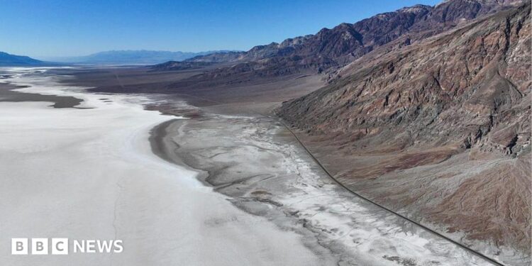 A view of Badwater Basin, a surreal salt flat, the lowest point in North America during extreme heat wave in Death Valley National Park of California, United States on August 2, 2026