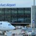A view of a taxiing area at Frankfurt Airport. A Lufthansa plane sits on the tarmac.