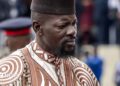 Guinea's President Mamady Doumbouya in a brown and white embroidered outfit in May 2026