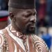 Guinea's President Mamady Doumbouya in a brown and white embroidered outfit in May 2026