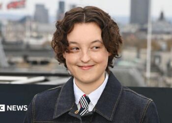 Bella Ramsey attends the HBO Max Experience London photocall at Piccadilly Lights on March 24, 2026 in London, England