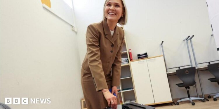 Iceland's Prime Minister Kristrun Frostadottir votes in the national referendum on resuming EU membership talks, at a polling station in Reykjavik