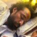 Devendra Nath Mahto lying on a mattress while he was on a hunger strike