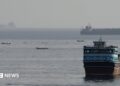 Vessels in the Strait of Hormuz, as seen from Musandam, Oman, August 3, 2026
