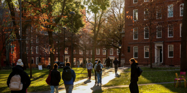 FILE PHOTO: Students walk on the Harvard campus