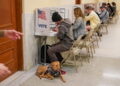 People vote at the San Francisco City Hall voting center in San Francisco