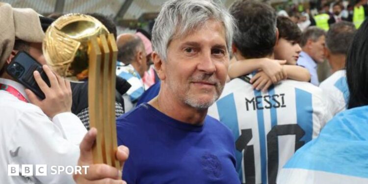 Jorge Messi holding his son Lionel Messi's trophy for best player at the 2022 World Cup after Argentina beat France in the final in Qatar