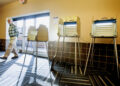 St. Louis County Election Official Chuck Wentworth walks around the empty polling room at The Heights in St. Louis