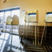 St. Louis County Election Official Chuck Wentworth walks around the empty polling room at The Heights in St. Louis