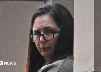 Erin Patterson during trial in Melbourne wearing glasses and her dark her down.