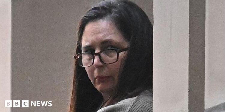 Erin Patterson during trial in Melbourne wearing glasses and her dark her down.