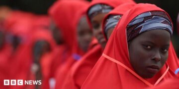 Brides wearing red hijabs from the 2023 Kano mass wedding in Nigeria