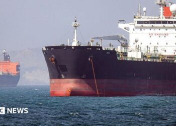 In this picture obtained from Iran's ISNA news agency and taken on May 2, 2026, the Gambia-flagged tanker vessel Bili is pictured anchored in the Strait of Hormuz off Bandar Abbas in southern Iran.