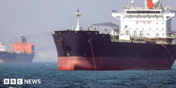 In this picture obtained from Iran's ISNA news agency and taken on May 2, 2026, the Gambia-flagged tanker vessel Bili is pictured anchored in the Strait of Hormuz off Bandar Abbas in southern Iran.