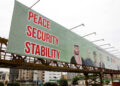 Billboard displays leaders following the signing of the Makkah Joint Defence Agreement, in Karachi