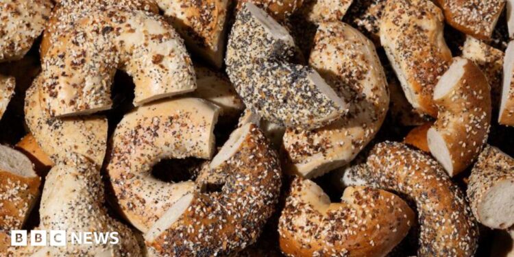 Everything bagels baked with a mix of toppings including garlic flakes, onion flakes, poppy seeds, sesame seeds and salt