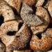 Everything bagels baked with a mix of toppings including garlic flakes, onion flakes, poppy seeds, sesame seeds and salt