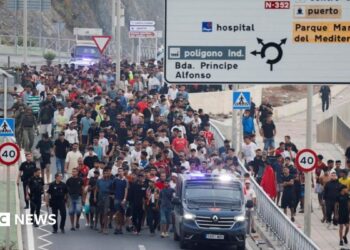 migrants swimming into Ceuta