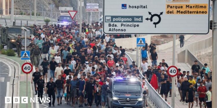 migrants swimming into Ceuta