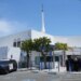 People gather near police vehicles outside the Islamic Center of San Diego.