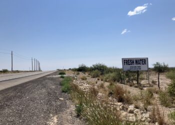 A sign on the side of the highway in the Permian Basin advertises fresh water for sale. Fracking requires significant volumes of water to complete wells.