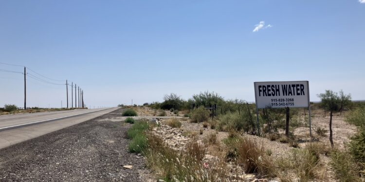A sign on the side of the highway in the Permian Basin advertises fresh water for sale. Fracking requires significant volumes of water to complete wells.